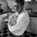 <p><b>William Claxton</b>, <i>Steve McQueen and His Family Cat, "Kitty Kat," Los Angeles</i>, 1964</p>
