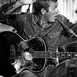 <p><b>William Claxton</b>, <i>Steve McQueen playing Guitare, Colombus, Texas</i>, 1963</p>