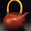 Shaner's Red Tea Pot, 1977, glazed stoneware, 6 7/8 x 9 1/4 in., photo by Anthony Cuñha, from Following The Rhythms Of Life: The Ceramic Art Of David Shaner