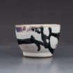 White pot with black drizzle by Alissa Lau
