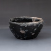 Black bowl with spots by Audrey Gasser