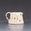 Small pitcher with carrot decoration by Ava Hedin