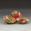 Small nerikomi clay bowls with pooled glass by Erin Gallagher