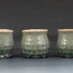 Three carved cups by Megan Chow